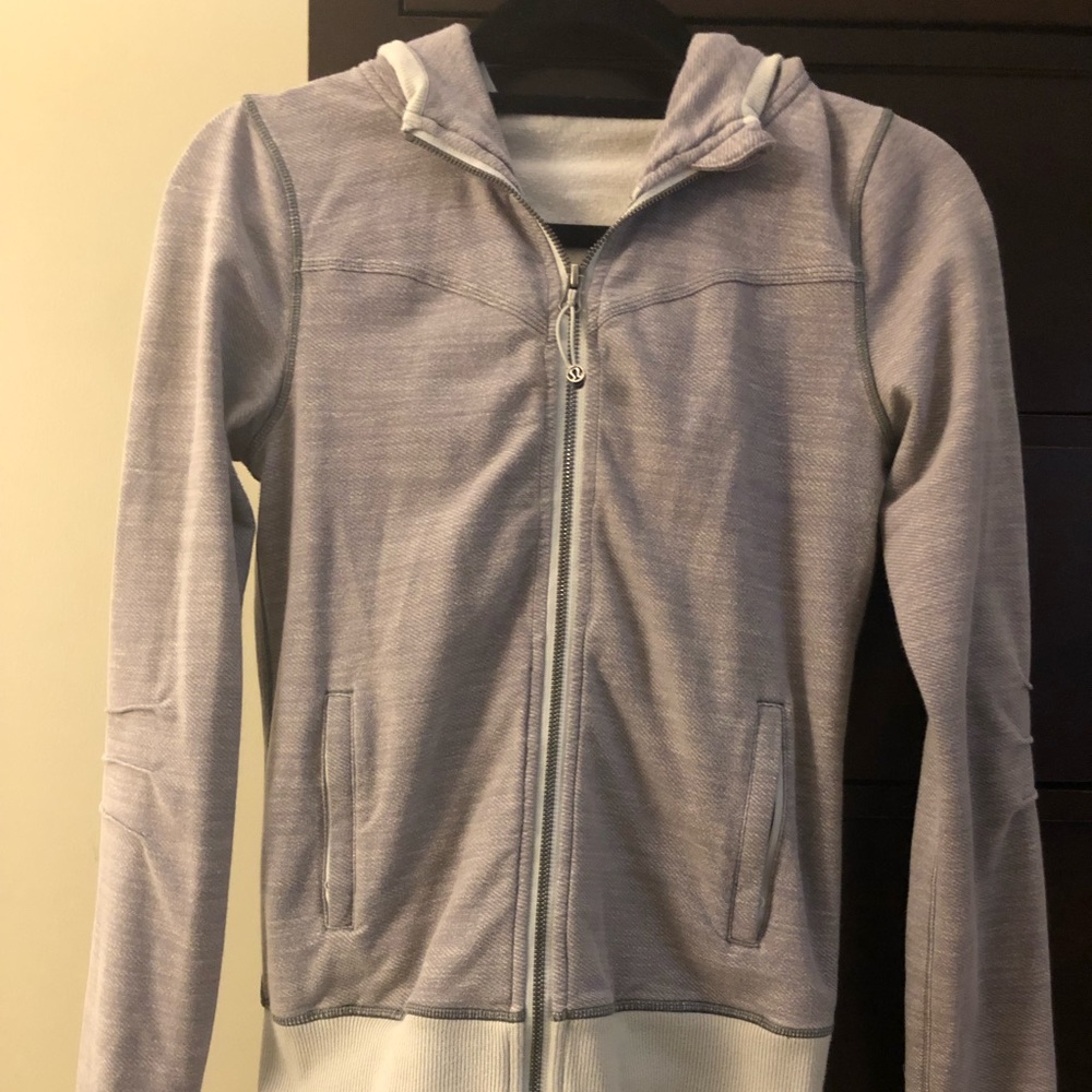 Lululemon zip up jacket. Size 4. Color regular gray and light gray color.